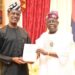 Oyedele Presents New Tax Acts To President Tinubu, Says Implementation Remains January 1, 2026